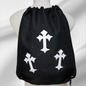 Black drawstring bag with white cross patterns embellished in rhinestones